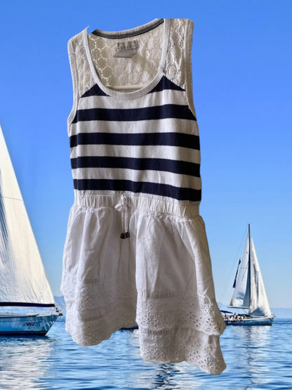 This Tahari's girl's dress boasts a stylish stripe design and a charming ruffle and floral bottom