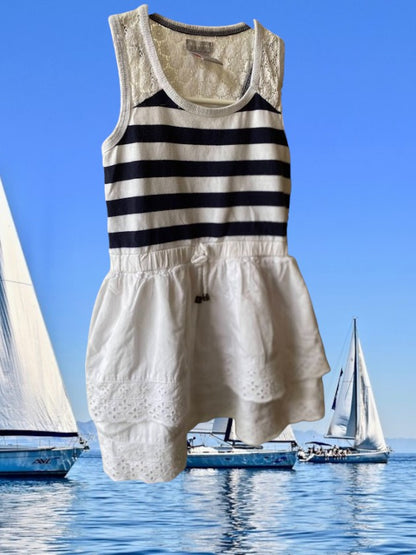 This Tahari's girl's dress boasts a stylish stripe design and a charming ruffle and floral bottom