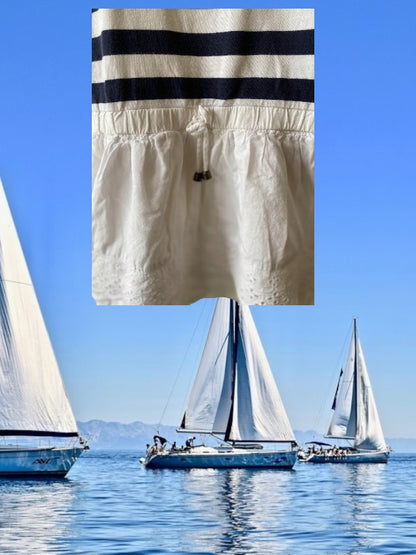 This Tahari's girl's dress boasts a stylish stripe design and a charming ruffle and floral bottom