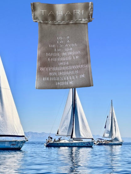 This Tahari's girl's dress boasts a stylish stripe design and a charming ruffle and floral bottom