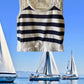 This Tahari's girl's dress boasts a stylish stripe design and a charming ruffle and floral bottom