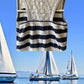 This Tahari's girl's dress boasts a stylish stripe design and a charming ruffle and floral bottom