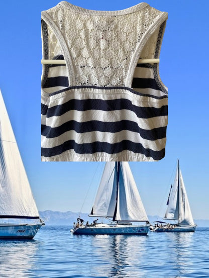 This Tahari's girl's dress boasts a stylish stripe design and a charming ruffle and floral bottom