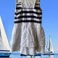This Tahari's girl's dress boasts a stylish stripe design and a charming ruffle and floral bottom