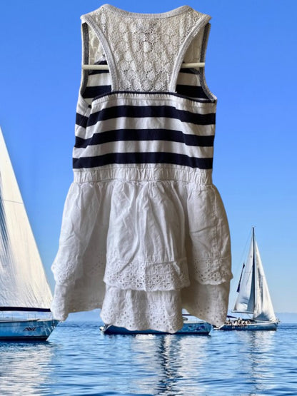 This Tahari's girl's dress boasts a stylish stripe design and a charming ruffle and floral bottom