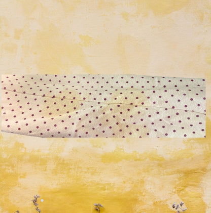 This Wonderkids polka dot long sleeve top is a stylish addition to any toddler's wardrobe