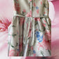 This summer party dress from Rare Editions features a lovely floral design