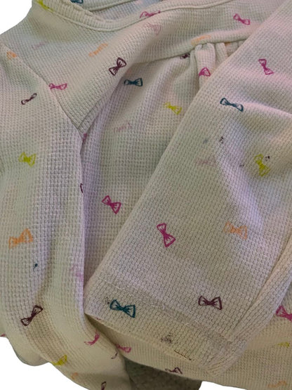 Circo Pattern Design Top features vibrant, multicolored bows throughout the design