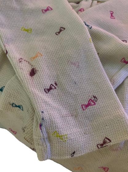 Circo Pattern Design Top features vibrant, multicolored bows throughout the design