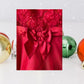 The Holiday Editions girl's sleeveless red floral dress features sequin floral decorations on the top and a front bow for a touch of elegance