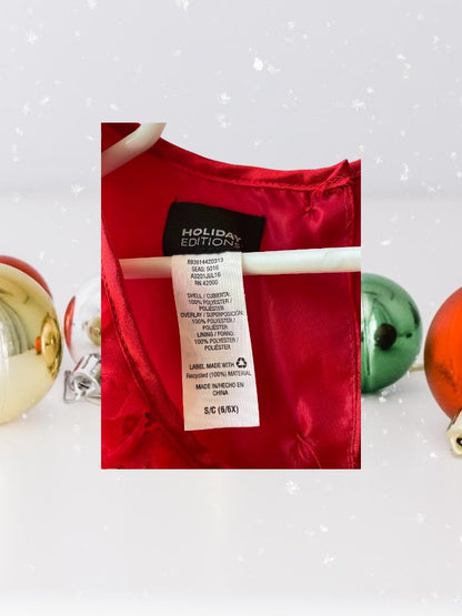 The Holiday Editions girl's sleeveless red floral dress features sequin floral decorations on the top and a front bow for a touch of elegance