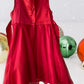The Holiday Editions girl's sleeveless red floral dress features sequin floral decorations on the top and a front bow for a touch of elegance