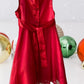 The Holiday Editions girl's sleeveless red floral dress features sequin floral decorations on the top and a front bow for a touch of elegance