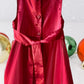 The Holiday Editions girl's sleeveless red floral dress features sequin floral decorations on the top and a front bow for a touch of elegance