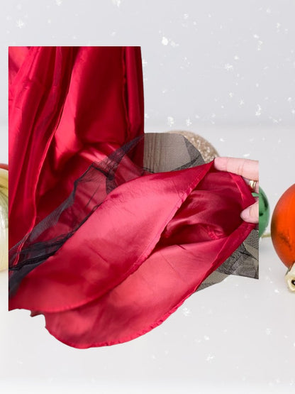 The Holiday Editions girl's sleeveless red floral dress features sequin floral decorations on the top and a front bow for a touch of elegance