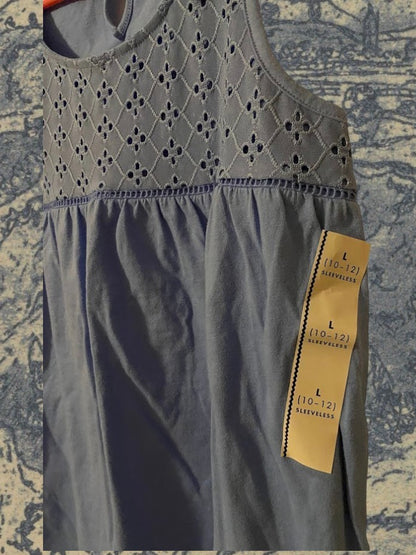 Sleeveless yoke tank top fitted on top and flowy on the bottom