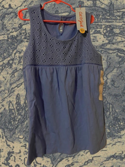 Sleeveless yoke tank top fitted on top and flowy on the bottom