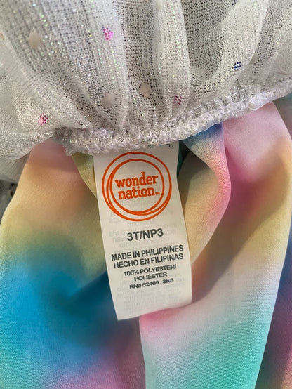 The Wonder Nation colorful reversible skirt features vibrant rainbow colors on one side and mesh with metallic dot designs on the other