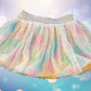 The Wonder Nation colorful reversible skirt features vibrant rainbow colors on one side and mesh with metallic dot designs on the other
