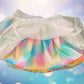The Wonder Nation colorful reversible skirt features vibrant rainbow colors on one side and mesh with metallic dot designs on the other