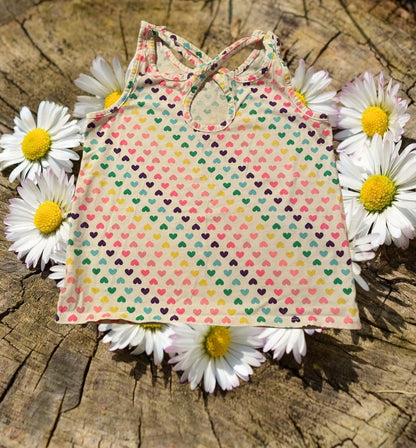 Add a pop of color and fun to any outfit with this stylish cotton tank top from The Children's Place