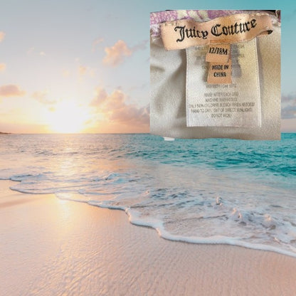 This one-piece bathing suit from Juicy Couture features a darling floral ruffle design