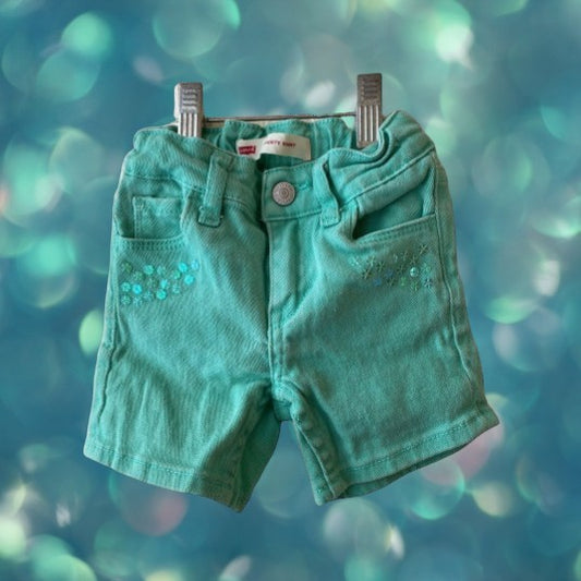Jean shorts with unique heart-shaped pockets and dazzling sequins