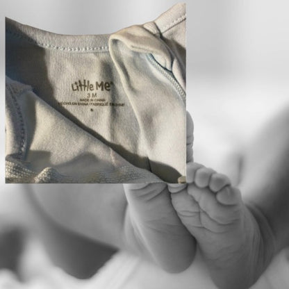 The Little Me Footed Appliqué Cotton Onesie features a charming bear appliqué design with boats