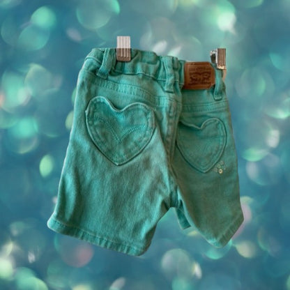 Jean shorts with unique heart-shaped pockets and dazzling sequins
