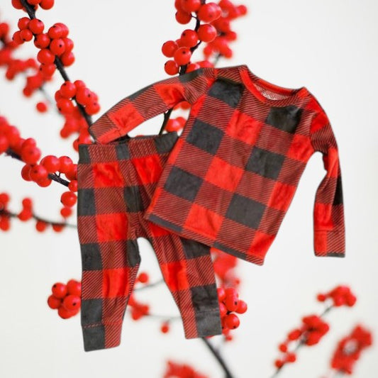 This 2pc pajama set from Cat &amp; Jack features a cool checker design and is made of incredibly soft fabric