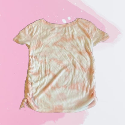 Bring some cheerful flair to your daughter's wardrobe with this Justice Tie Dye Short Sleeve Top