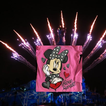 Celebrate your little one’s love for Disney with the “How Sweet” Minnie Cotton Glitter Graphic Tee