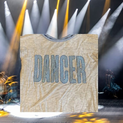 The Justice Glitter Dancer Graphic Tee is perfect for any young girl looking to add some extra sparkle to her wardrobe