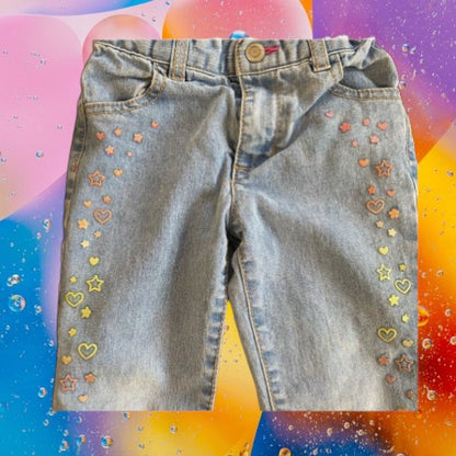 Featuring a unique appliqué design of glitter hearts and stars, these Healthtex jeans are very pretty and fashionable