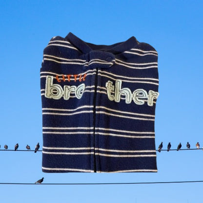 This Carter’s Just One You Little Brother Cotton Footie features a colorful graphics stripe design and convenient full zip closure