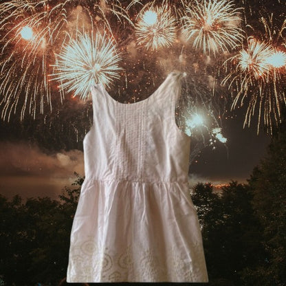 This beautiful Shrinking Violet cotton dress boasts a crocheted design