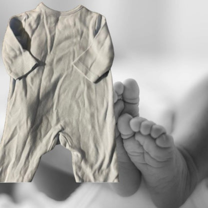 The Little Me Footed Appliqué Cotton Onesie features a charming bear appliqué design with boats