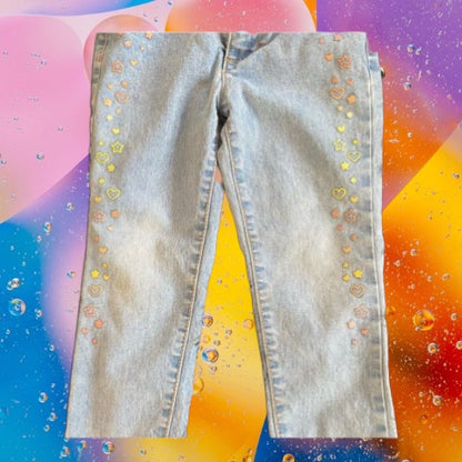 Featuring a unique appliqué design of glitter hearts and stars, these Healthtex jeans are very pretty and fashionable
