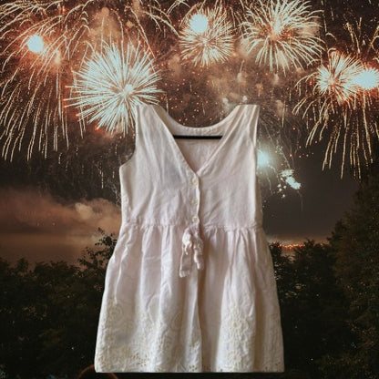 This beautiful Shrinking Violet cotton dress boasts a crocheted design