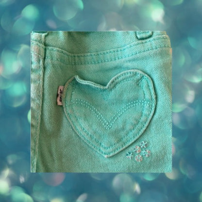 Jean shorts with unique heart-shaped pockets and dazzling sequins