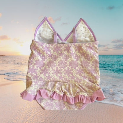 This one-piece bathing suit from Juicy Couture features a darling floral ruffle design