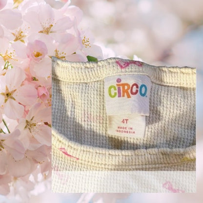 Circo Pattern Design Top features vibrant, multicolored bows throughout the design