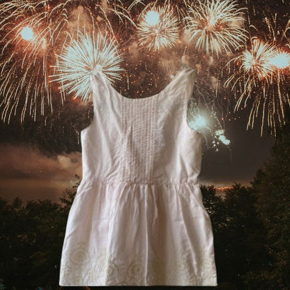 This beautiful Shrinking Violet cotton dress boasts a crocheted design