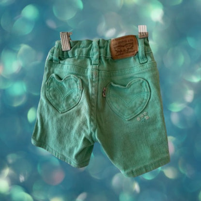 Jean shorts with unique heart-shaped pockets and dazzling sequins