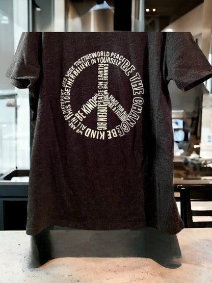 Black graphic tee featuring a pattern of inspirational sayings