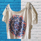 This Justice Girl's Lace Top features a striking blend of colors, enhanced by glitter and rhinestones